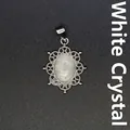 Elegant vintage hollow filigree pendant necklace featuring natural white crystal stone - White Crystal
