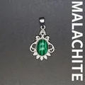 Vintage silver-tone pendant featuring an oval green malachite stone inlay - Malachite