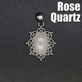 Elegant hollow filigree metal pendant featuring a smooth oval natural rose quartz stone - Rose Quartz