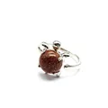Adorable silver-colored turtle open ring featuring a shimmering brown goldstone shell. - Gold Sandstone