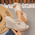 Close-up of linen texture wedge sandals with high platform and metal logo detail. - Off White