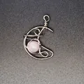 Artisanal handmade wire-wrapped crescent moon pendant featuring a rose quartz gem - Rose Quartz Moon / Silver