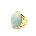 Detailed close-up view of a gold-plated ring featuring a faceted pear-shaped blue stone. - Amazonite