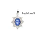 Intricate silver hollow pendant necklace featuring an oval natural blue lapis lazuli stone - Lapis Lazuli