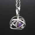 Detailed macro shot of silver hollow orbital pendant featuring a purple natural stone bead - Amethyst