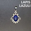 Vintage oval lapis lazuli gemstone pendant with intricate silver-tone filigree frame detail - Lapis Lazuli