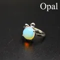 Silberfarbener, verstellbarer Ring in Schildkrötenform mit einem runden blauen Opal - Opal