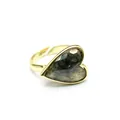 Close-up of a vintage gold heart ring with a dark grey faceted natural stone detail - Labradorite
