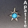 Handcrafted silver wire-wrapped sun pendant featuring a natural blue apatite gemstone - Apatite Sun / Silver