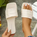 Women's off-white square-toe flat slide sandals with a wide pleated strap design - Beige