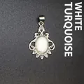 Vintage silver-toned pendant featuring a polished oval white turquoise stone in ornate frame - Howlite