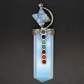 Detailed macro view of a 7 chakra stone sword pendant with opalite and merkaba star - Opal