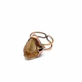 Detailed view of a medieval vintage copper ring featuring a raw natural yellow crystal - Citrine