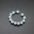 Macro view of a wire-wrapped open ring featuring translucent opalite beads on gray surface - Open Wire Wrapped Style / 11 Pcs 8mm Round Beads / Opal