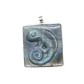Detailed view of a square natural labradorite pendant featuring a carved chameleon figure. - Chameleon Relief (1) / 39x32x11mm