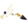 Detailed close-up of a blue resin hexagonal dowsing pendulum with gold chain and lotus charm. - Lapis Lazuli