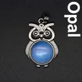 Squisito ciondolo a forma di gufo in cristallo con opale blu e finitura in argento - Opale