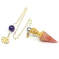 Detailed view of hexagonal crystal resin dowsing pendulum with gold filigree and lotus charm - Rose Quartz