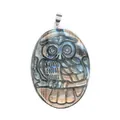 Detailed macro shot of an oval labradorite pendant with an intricate owl carving - Owl Figure (Style 2)