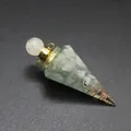Macro detail of hexagonal resin cone pendant filled with natural tourmaline stone chips - Aquamarine-Gold Tone