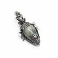 Detailed view of a vintage silver filigree pendant with an egg-shaped natural stone. - Pendant Only (Without Chain) / Labradorite