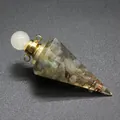 Detailed view of resin pyramid craft with natural tourmaline stones and copper wire - Labradorite-Gold