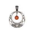 Detail view of a vintage silver Celtic knot pendant with natural red and clear stones - Red Jasper