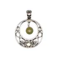 Close-up of vintage silver Celtic moon pendant featuring a green natural stone bead. - India Agate