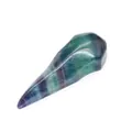 Detailed macro view of a carved natural green and purple fluorite bird skull crystal ornament - Colorful Fluorite