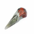 Macro view of natural stone bird skull carving with unique jasper patterns - African Blood Stone