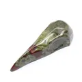 Polished natural stone carved into a stylized bird skull ornament for Halloween decor - Dragon Blood Stone