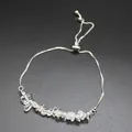 Detailed shot of irregular natural clear crystal chips on a silver-toned bolero chain - White Crystal