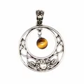 Detailed view of an antique silver hollow moon pendant featuring a tiger eye stone bead - Tiger's Eye