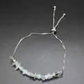 Close-up of natural irregular light blue stone bracelet with adjustable slider chain - Aquamarine