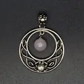 Macro view of Celtic knot moon pendant with pink quartz bead and silver finish - Rose Quartz