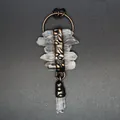 Detail shot of a vintage clear quartz crystal tassel pendant with antique metal finish - Horizontal Quartz Crystal Raw Stone Tassel Style