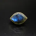 Detailed view of faceted blue labradorite stone in a gold Eye of Horus ring. - Labradorite / Adjustable Open