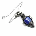 Detail shot of an antique silver crystal pendulum pendant featuring a blue lapis lazuli stone - Pendant With Pendulum Chain / Lapis Lazuli