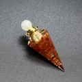 Close-up view of a hexagonal pyramid resin aromatherapy bottle with tourmaline gravel - Red Agate-Gold