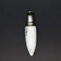 Close-up detail of a white marble texture bullet shaped natural stone pendant. - Howlite Pendant