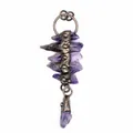 Close-up detail of a vintage raw amethyst crystal pendant with antique bronze metal. - Amethyst Raw Stone Layered Tassel Style