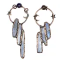 Detailed view of raw blue kyanite pendants with vintage copper moon and star motifs - Kyanite Star Moon Style