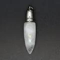 Detailed macro view of a white natural stone bullet-shaped pendant with silver metal cap - Clear Crystal Pendant