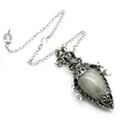 Detail of antique silver crystal pendulum pendant with ornate metal casing and pentagram - Pendant With Pendulum Chain / Labradorite
