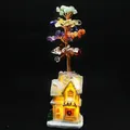 Detailed view of handmade chakra crystal tree with glowing LED cafe house base - Landscape House (Cafe)