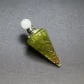 Macro detail of hexagonal resin pyramid pendant with peridot stones and copper coil - Peridot-Silver Tone