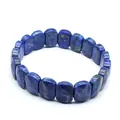 Close-up detail of a faceted natural lapis lazuli stone bracelet with unique blue texture - Lapis Lazuli