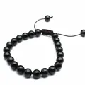 Detailed view of 8mm polished black onyx stone bead adjustable braided bracelet - Obsidian