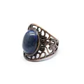 Detailed view of a vintage hollow bronze ring featuring an oval blue natural stone - Lapis Lazuli