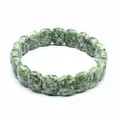 Close-up of green mottled natural stone rectangle bead bracelet on white background - Green Spotted Stone